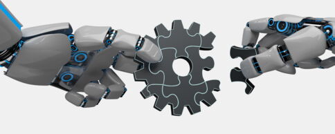 Zwei graue Roboterhände setzen ein Zahnrad aus neun Puzzleteilen zusammen.